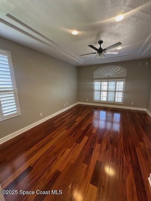 962 Balmoral Way Melbourne, FL 32940 - Photo 10 of 14 wooden floor in an empty room with a window