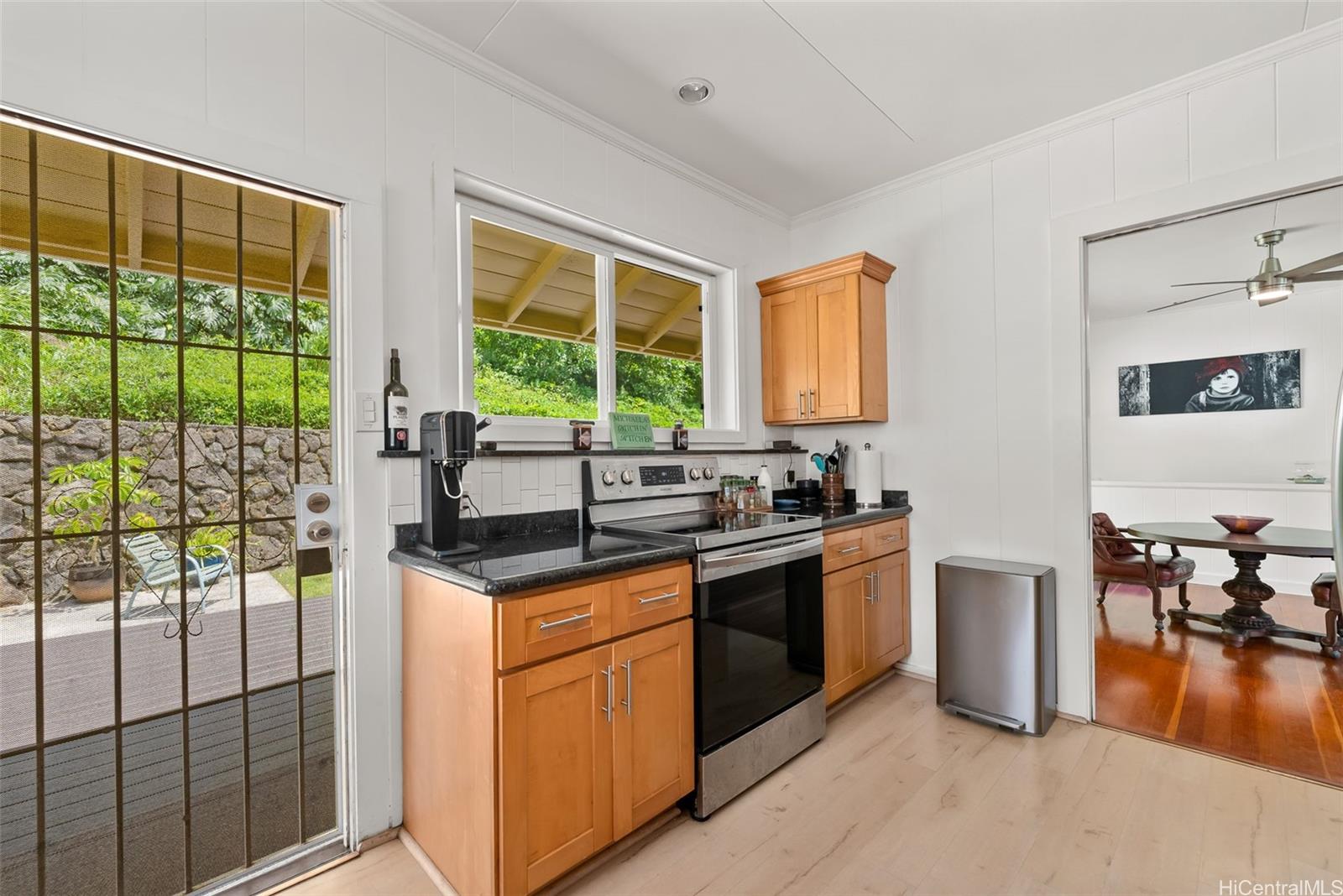 2811 Henry Street Honolulu, HI 96817 - Photo 10 of 25 Cook with the door open! A charming back door with a security screen allows you to enjoy the fresh air and lush backyard views while preparing meals.