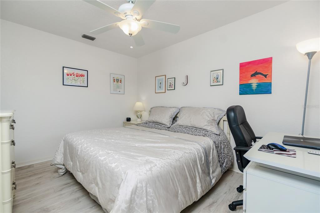 4260 Placida Road, Unit 9B Englewood, FL 34224 - Photo 17 of 38 a bed room with a bed and a desk