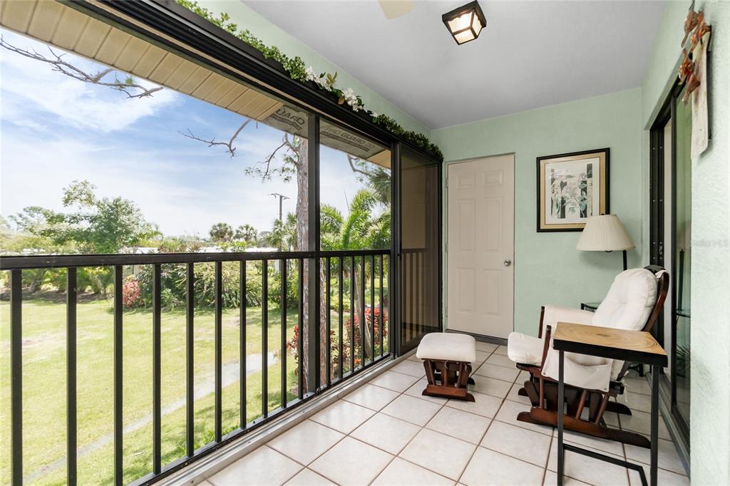 4260 Placida Road, Unit 9B Englewood, FL 34224 - Photo 22 of 38 a bedroom with furniture and a window