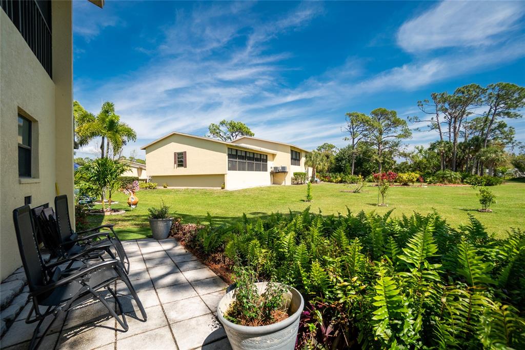 4260 Placida Road, Unit 9B Englewood, FL 34224 - Photo 33 of 38 a front view of a house with garden