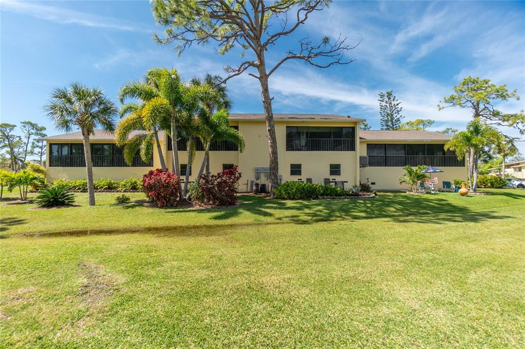 4260 Placida Road, Unit 9B Englewood, FL 34224 - Photo 34 of 38 a front view of a house with garden