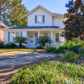 a front view of house with yard and swimming pool
