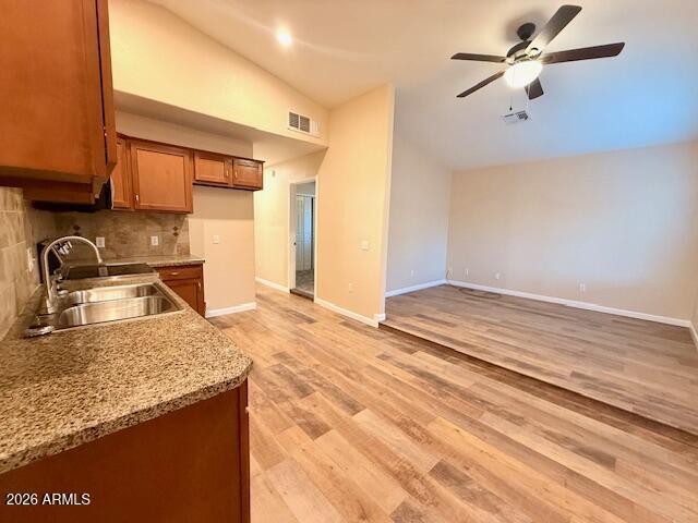 324 South Ocotillo Drive Apache Junction, AZ 85120 - Photo 5 of 14 a kitchen with a sink a stove and a refrigerator