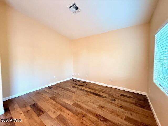 324 South Ocotillo Drive Apache Junction, AZ 85120 - Photo 6 of 14 a view of a room with wooden floor and white walls