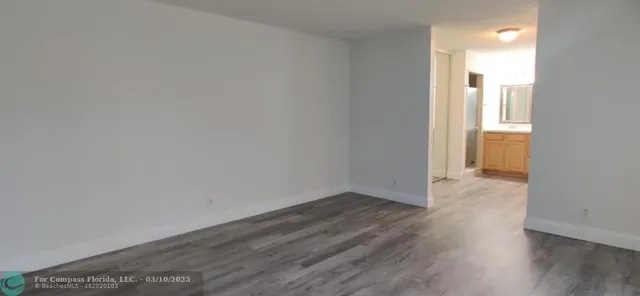 a bathroom with double vanity sink and a mirror