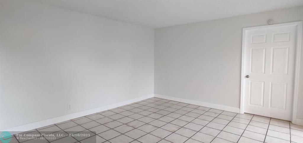 681 Springdale Circle Palm Springs, FL 33461 - Photo 4 of 17 a view of an empty room