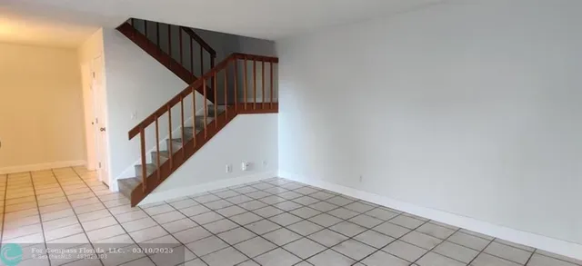 a bathroom with a sink a light fixture and a stove
