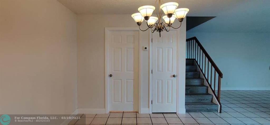 681 Springdale Circle Palm Springs, FL 33461 - Photo 7 of 17 a view of a chandelier fan and kitchen view