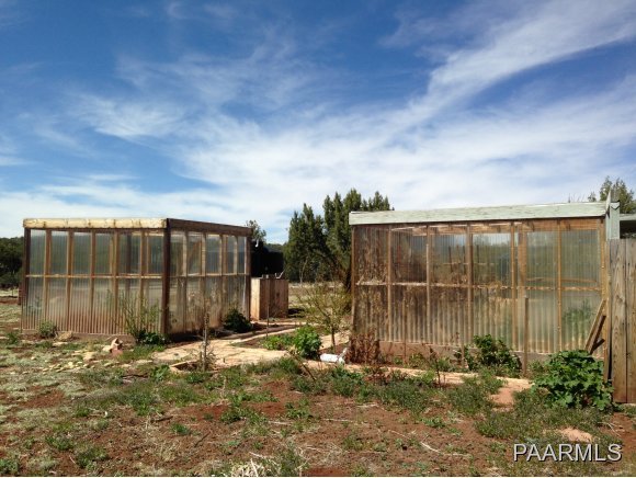 3258 North Double A Rnch Road Williams, AZ 86046 - Photo 2 of 18 a backyard of a house with a large tree