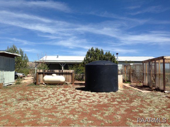 3258 North Double A Rnch Road Williams, AZ 86046 - Photo 4 of 18 a view of a backyard with furniture and a tub