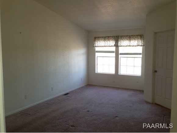 3258 North Double A Rnch Road Williams, AZ 86046 - Photo 9 of 18 an empty room with a window