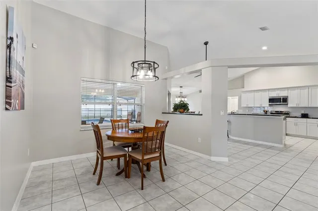 a view of a dining room with furniture and window