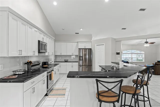 a room with furniture and view of living room