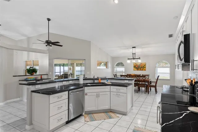 a bathroom with a glass shower door and a window