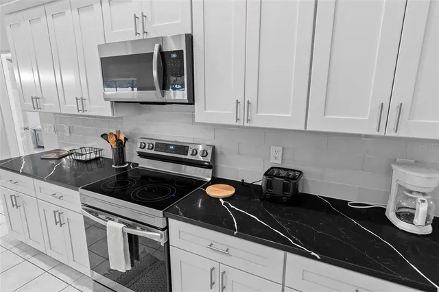 a bedroom with two beds and a window