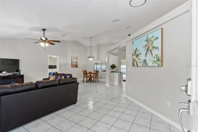 a view of a dining room with furniture and window