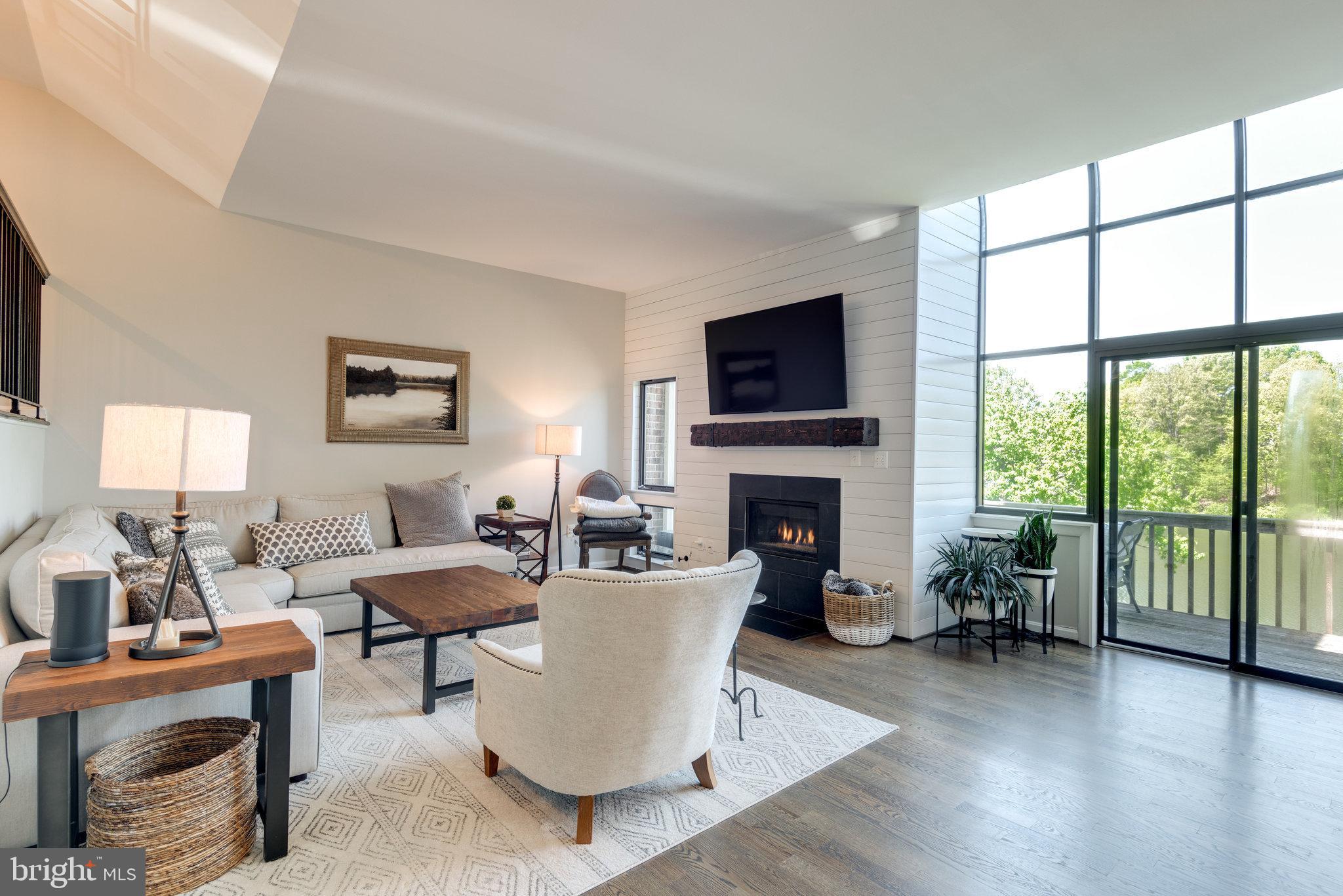 10998 Thrush Ridge Road Reston, VA 20191 - Photo 15 of 40 Shiplap wall detail around the gas fireplace