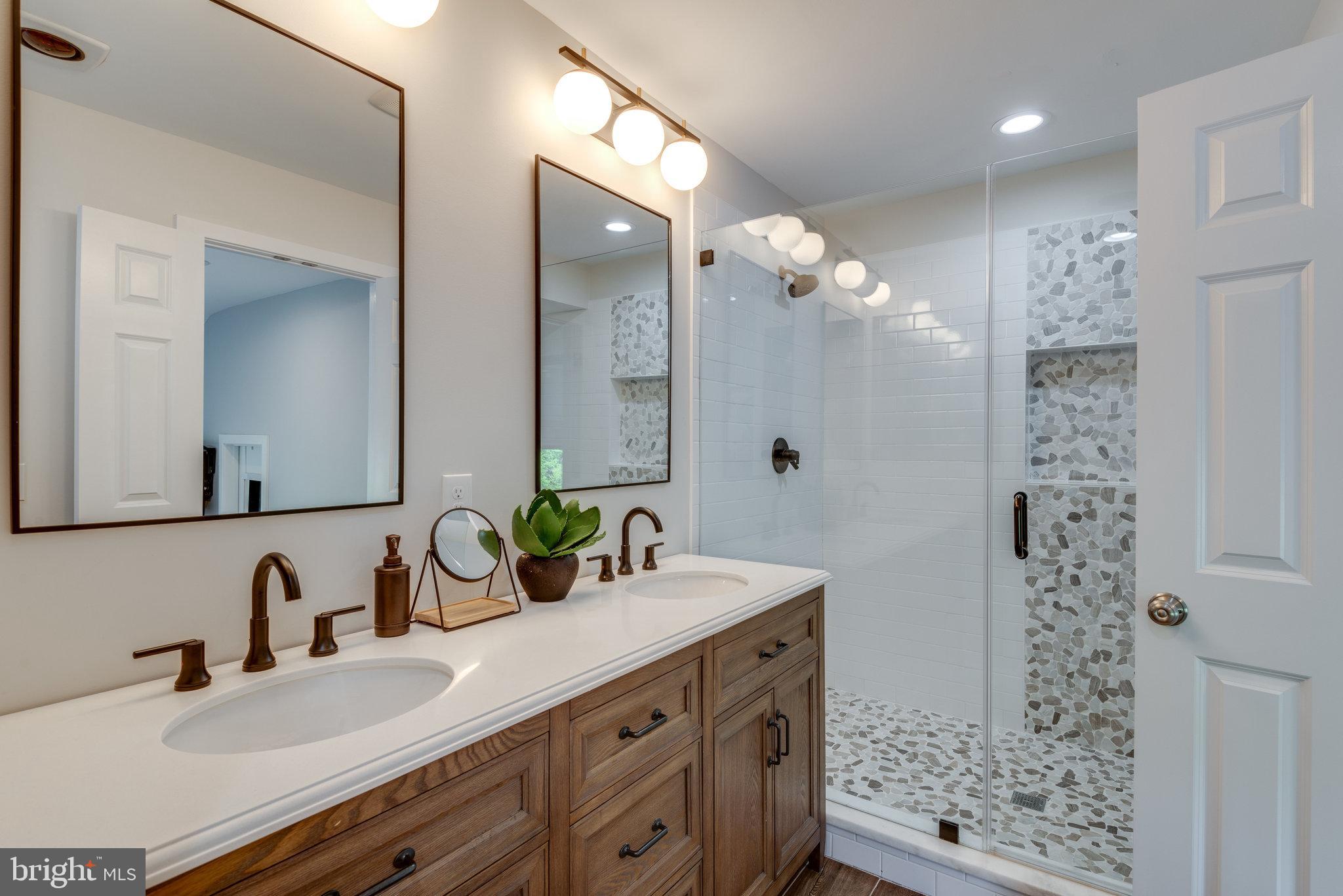 10998 Thrush Ridge Road Reston, VA 20191 - Photo 22 of 40 Walk-in shower with dual head fixture