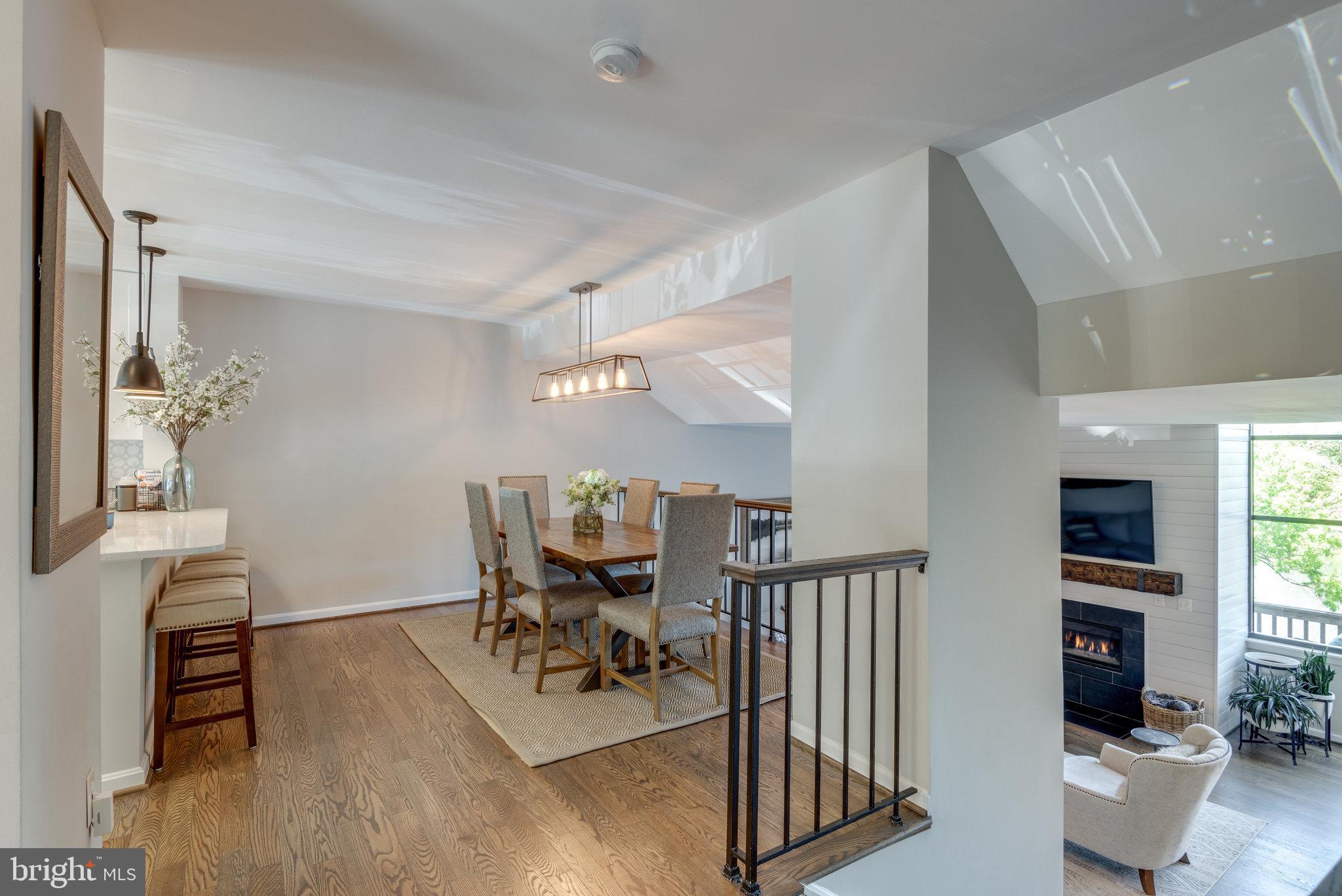 10998 Thrush Ridge Road Reston, VA 20191 - Photo 8 of 40 Wrought iron railings between dining/living room