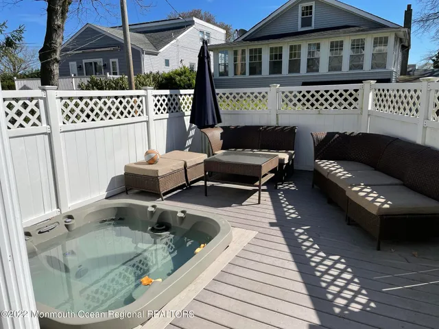 a terrace of a house with outdoor seating
