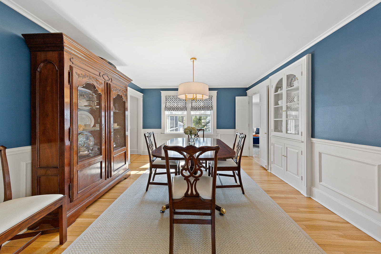 70 Middlesex Road Darien, CT 06820 - Photo 12 of 36 a view of a dining room with furniture window and wooden floor