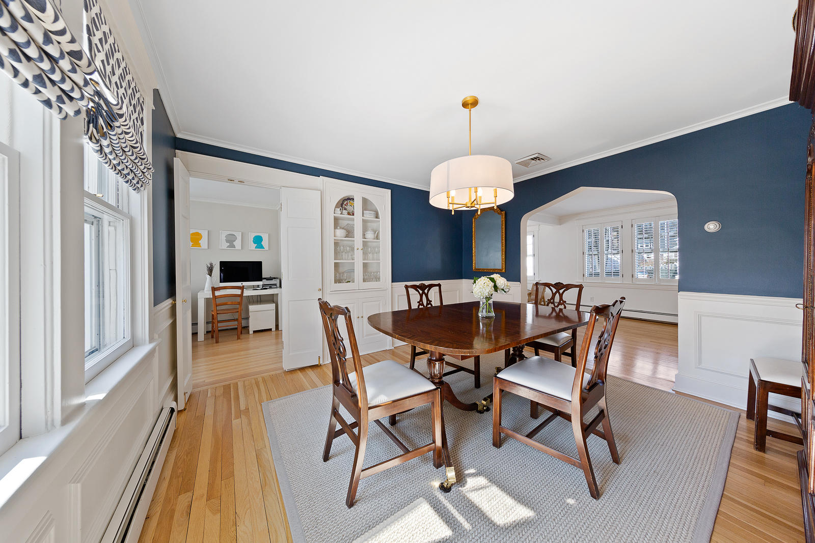 70 Middlesex Road Darien, CT 06820 - Photo 13 of 36 a view of a dining room with furniture and wooden floor
