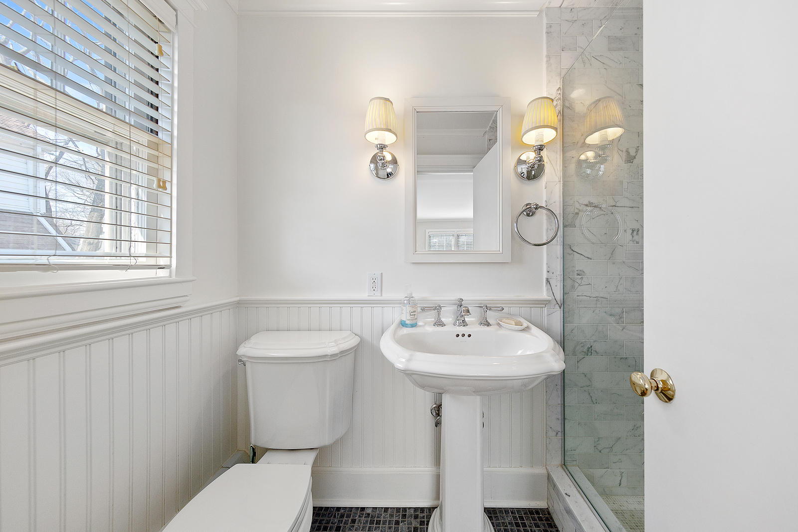 70 Middlesex Road Darien, CT 06820 - Photo 15 of 36 a bathroom with a sink toilet and mirror