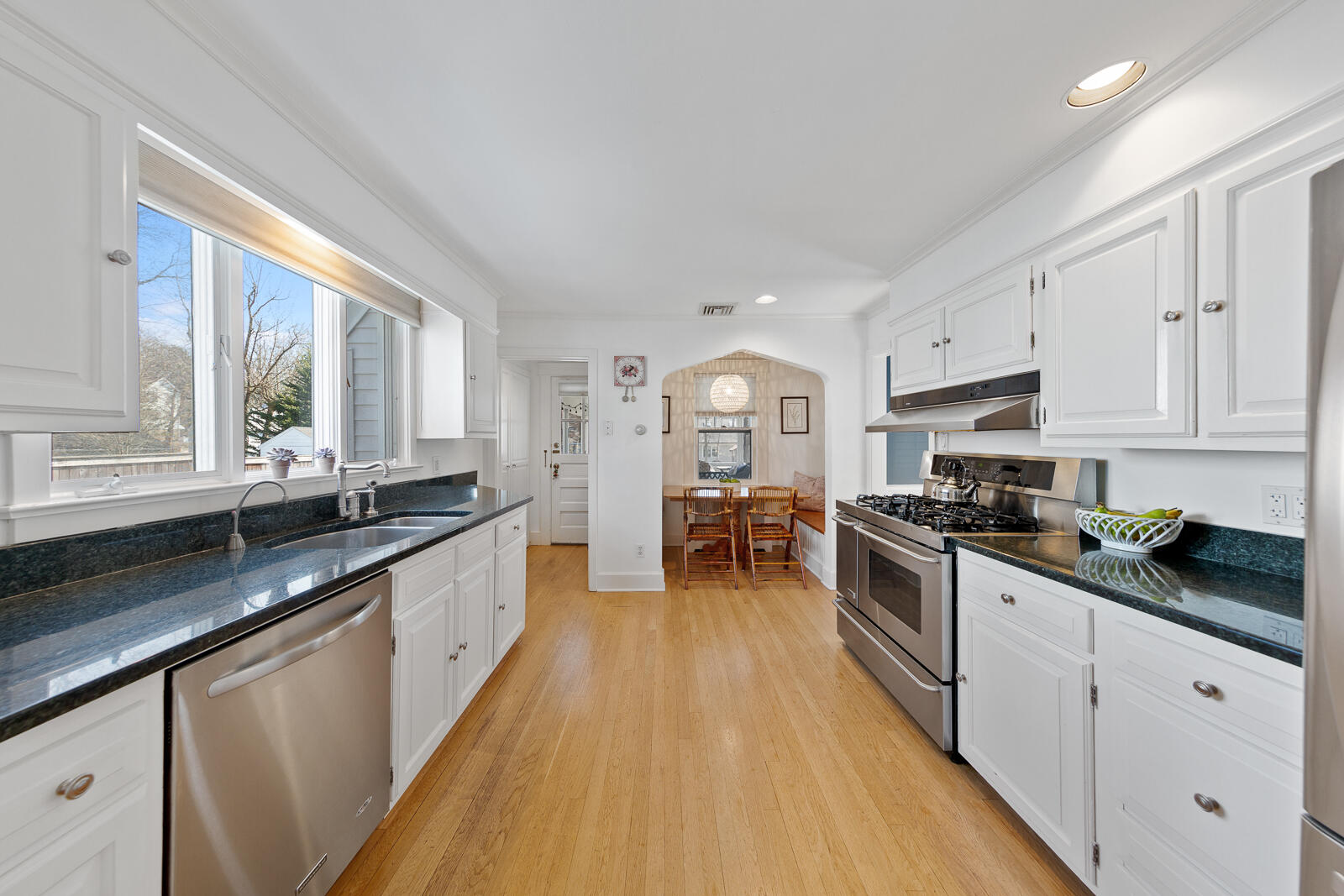 70 Middlesex Road Darien, CT 06820 - Photo 16 of 36 a large kitchen with stainless steel appliances granite countertop a stove a sink dishwasher and a oven with white cabinets