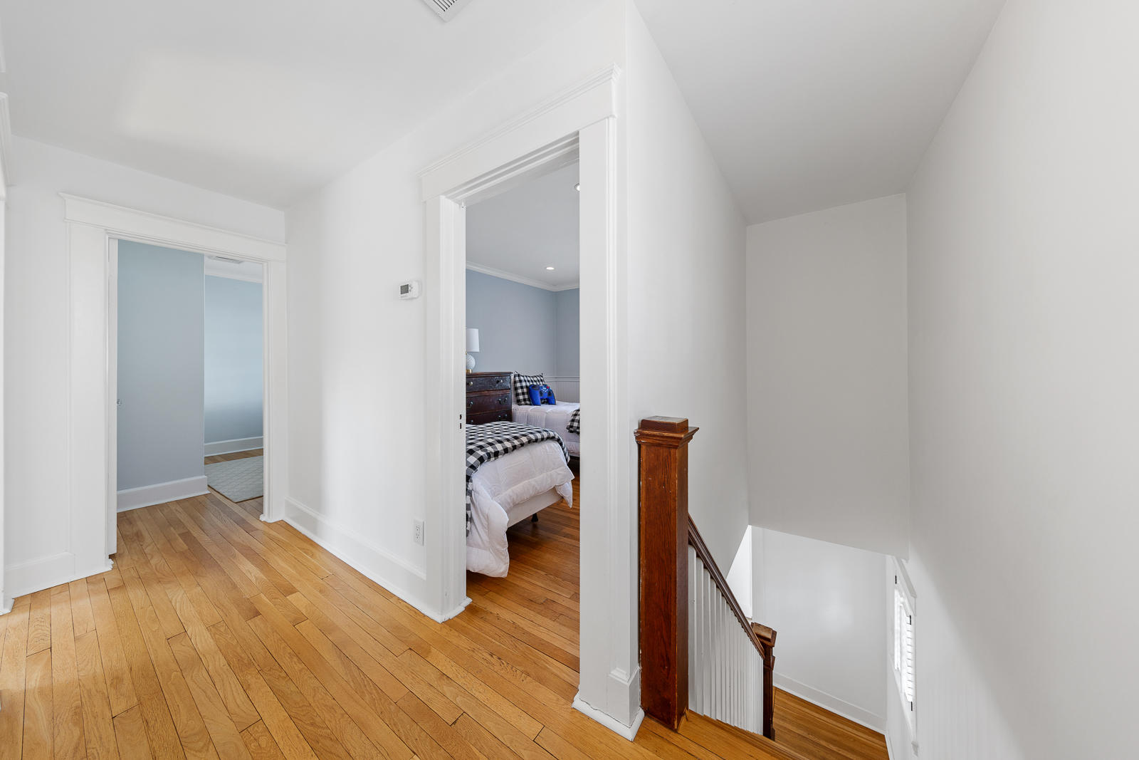 70 Middlesex Road Darien, CT 06820 - Photo 20 of 36 a view of a bedroom with wooden floor and furniture