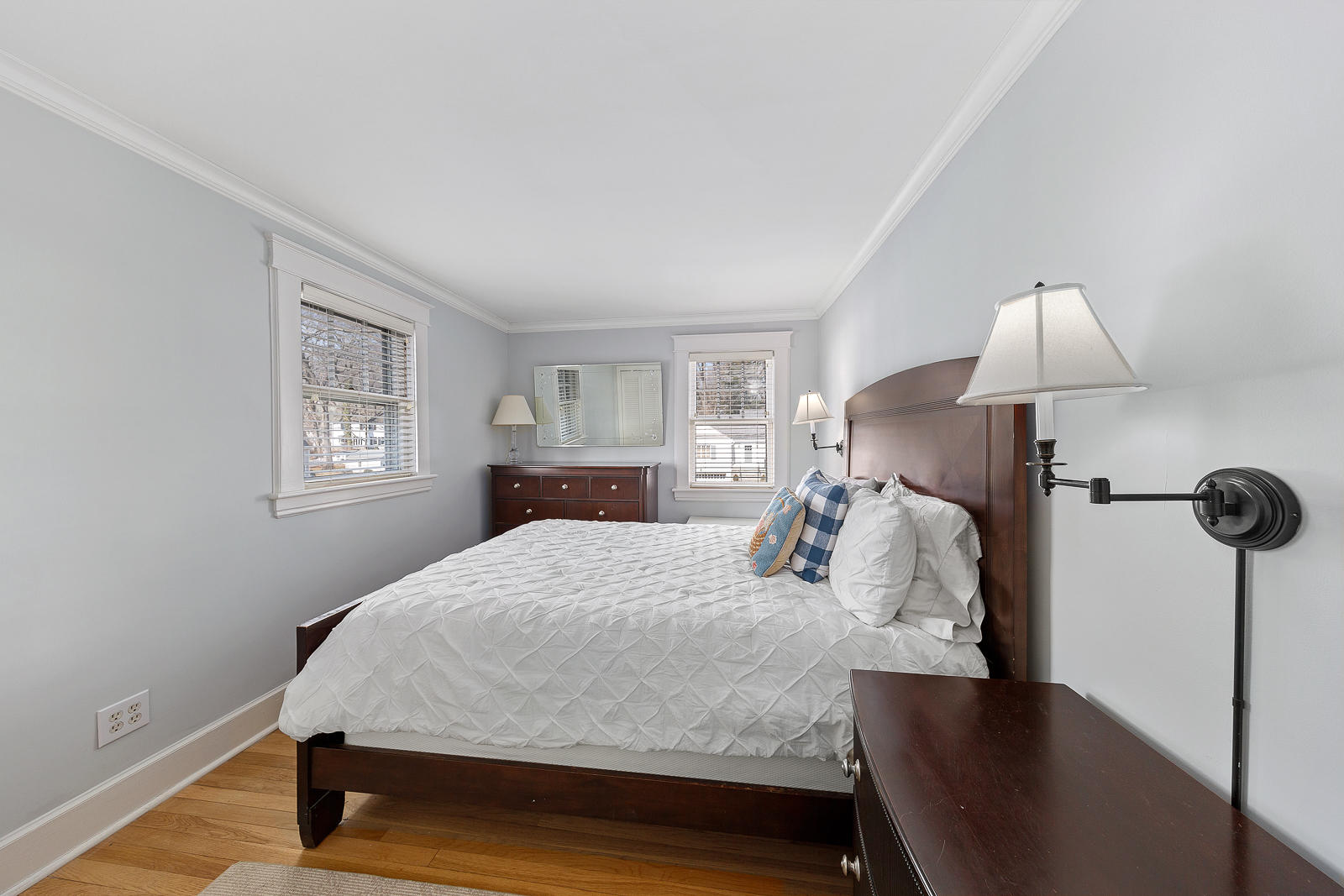 70 Middlesex Road Darien, CT 06820 - Photo 21 of 36 a bedroom with a bed and a lamp