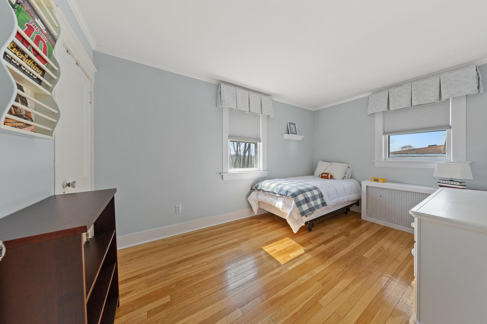 70 Middlesex Road Darien, CT 06820 - Photo 22 of 36 a bedroom with a bed and a dresser next to a window