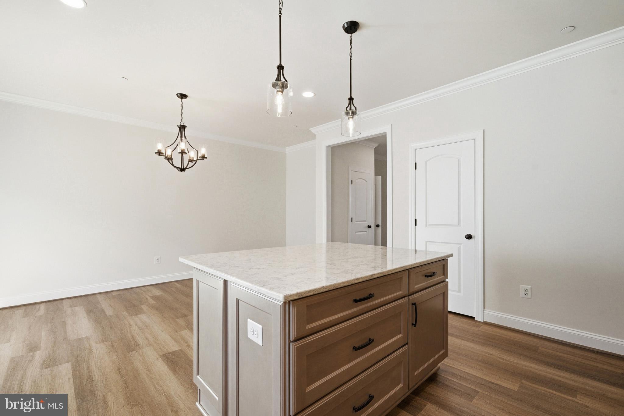 106 Potomac Court Prince Frederick, MD 20678 - Photo 11 of 47 a room with a table chairs and wooden floor