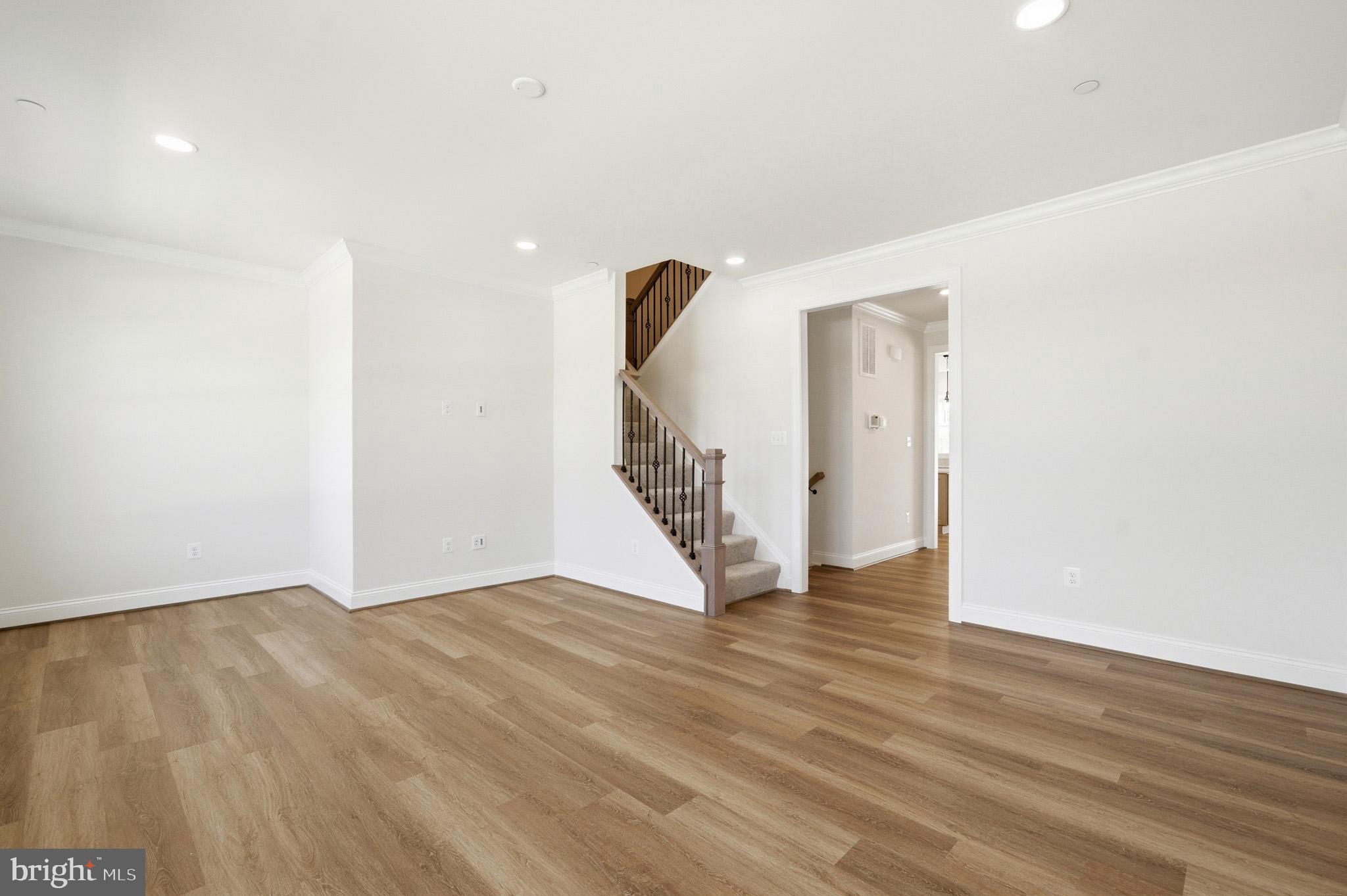 106 Potomac Court Prince Frederick, MD 20678 - Photo 18 of 47 a view of an empty room with wooden floor and stairs