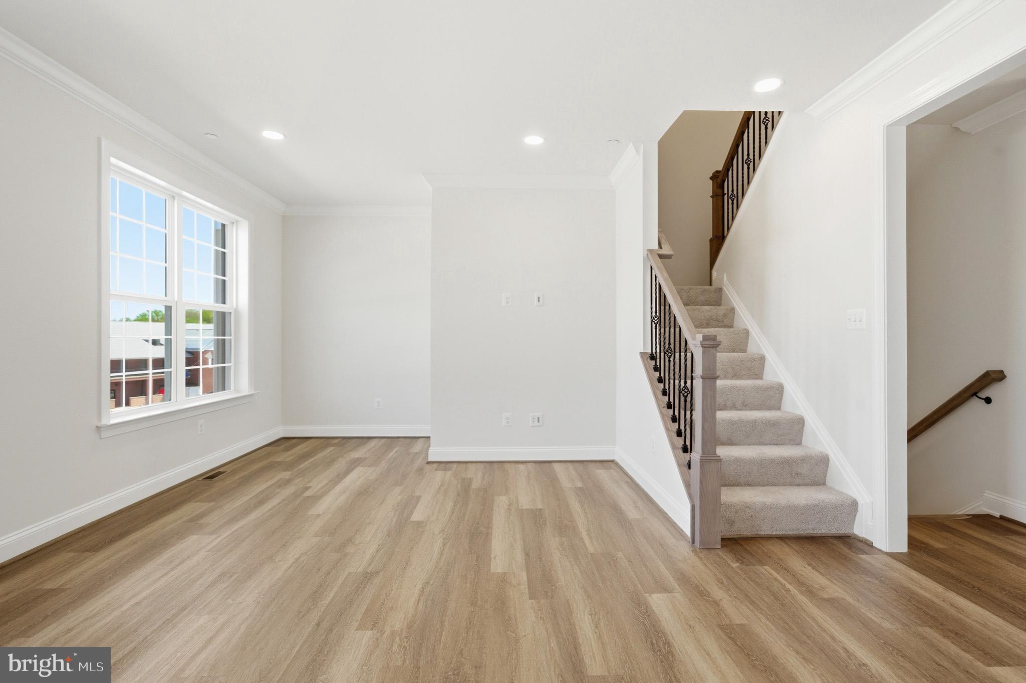 106 Potomac Court Prince Frederick, MD 20678 - Photo 20 of 47 a view of entryway with wooden floor and stairs