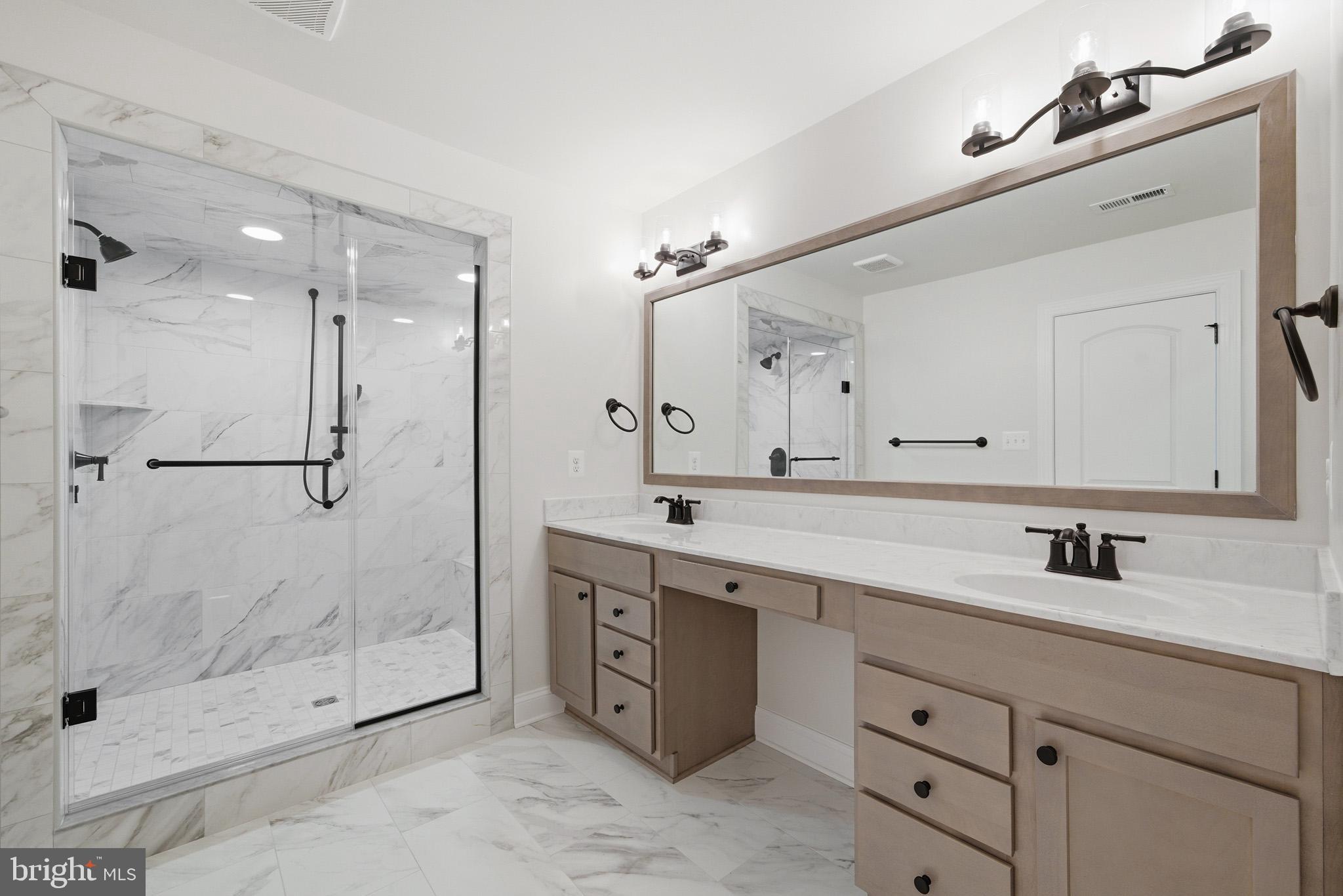 106 Potomac Court Prince Frederick, MD 20678 - Photo 25 of 47 a bathroom with a shower sink vanity and mirror