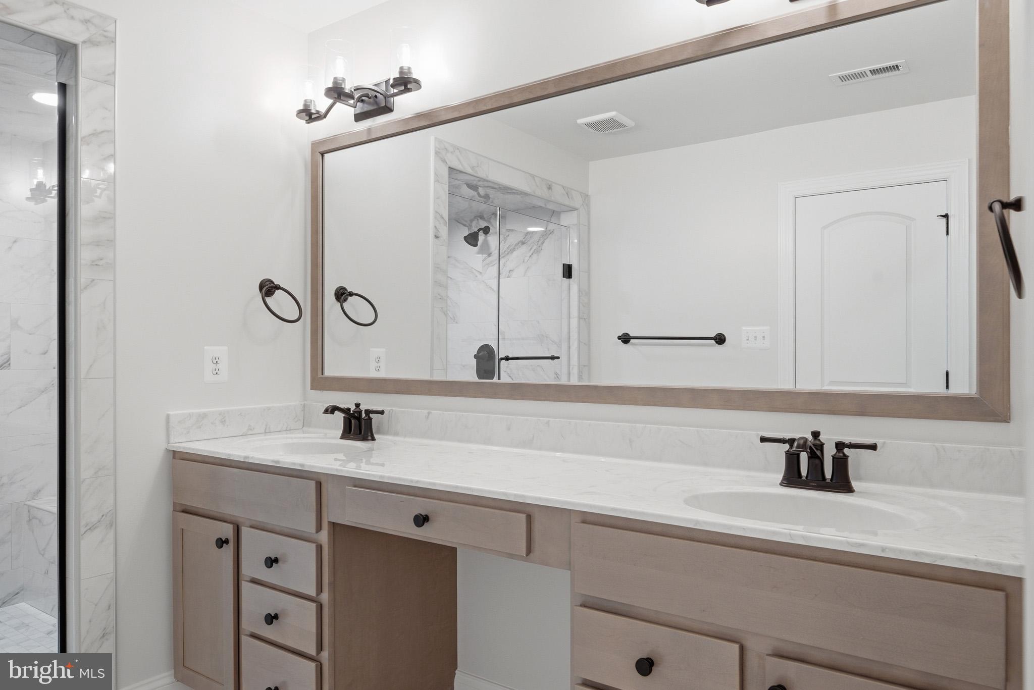 106 Potomac Court Prince Frederick, MD 20678 - Photo 26 of 47 a bathroom with a sink and a mirror