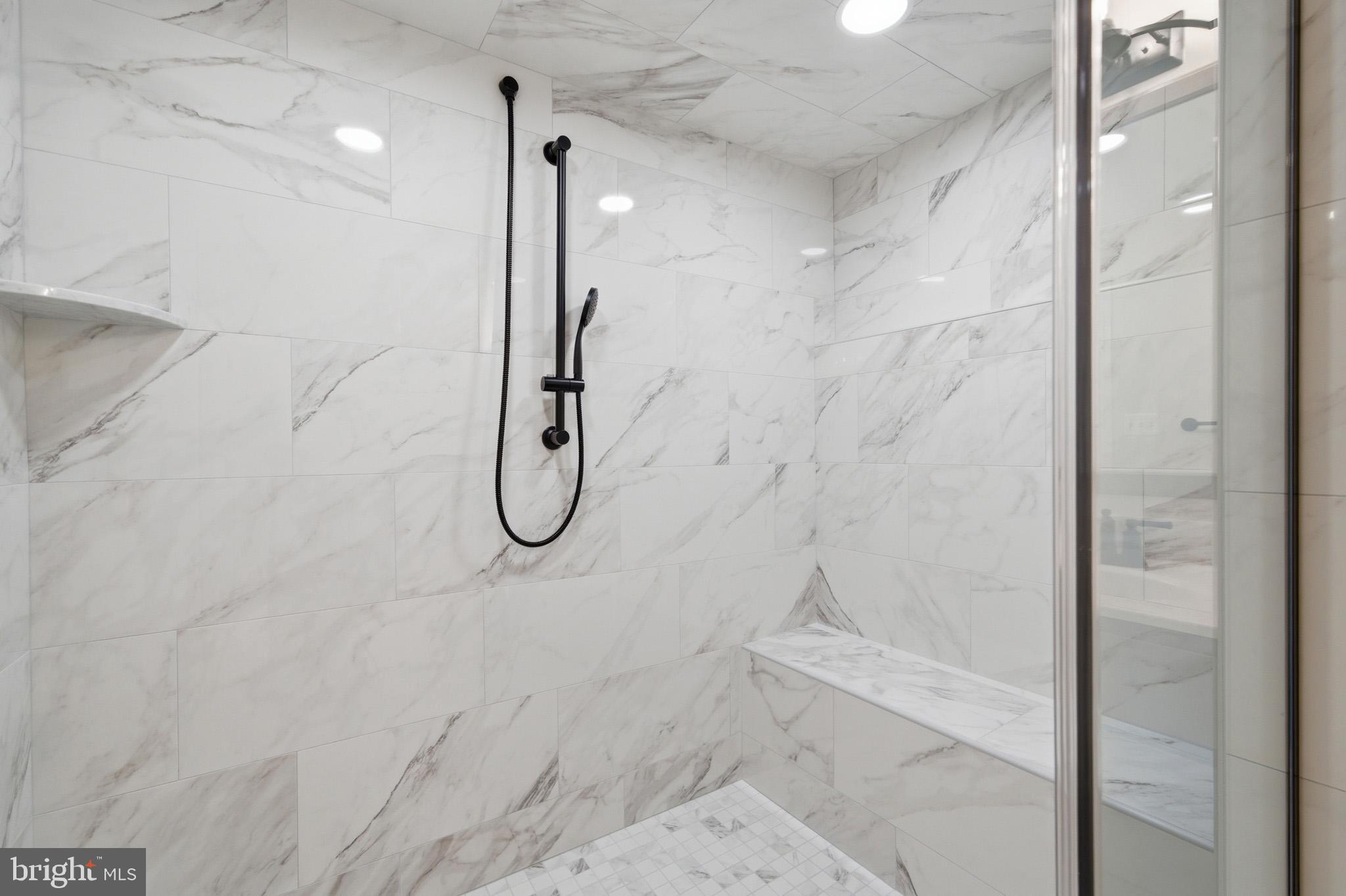 106 Potomac Court Prince Frederick, MD 20678 - Photo 28 of 47 a bathroom with a glass shower door