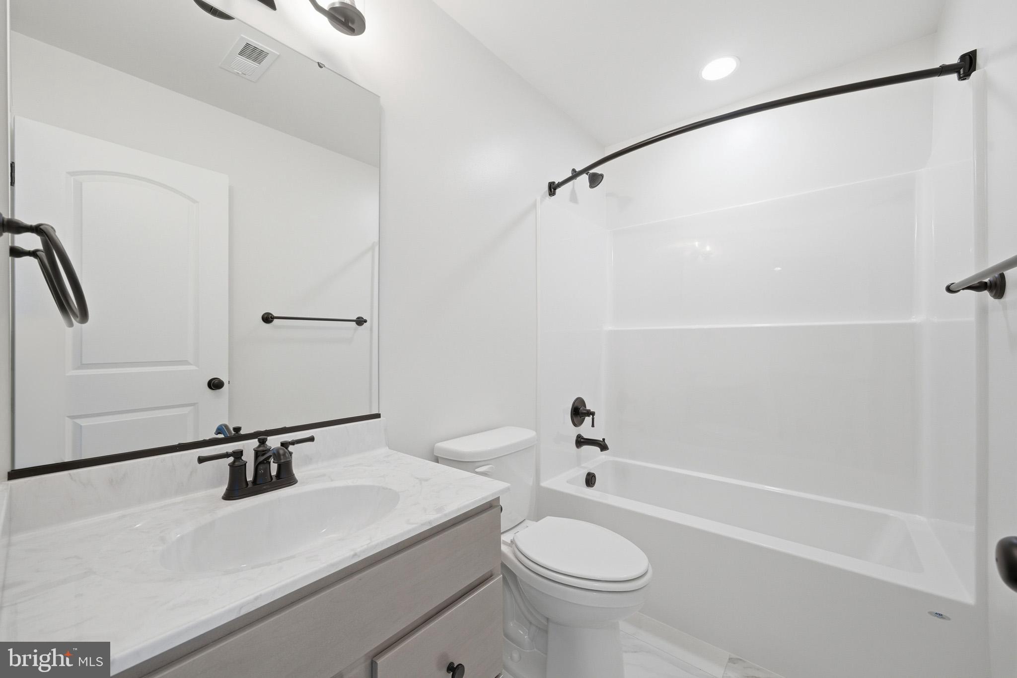 106 Potomac Court Prince Frederick, MD 20678 - Photo 32 of 47 a bathroom with a sink a toilet and a bathtub
