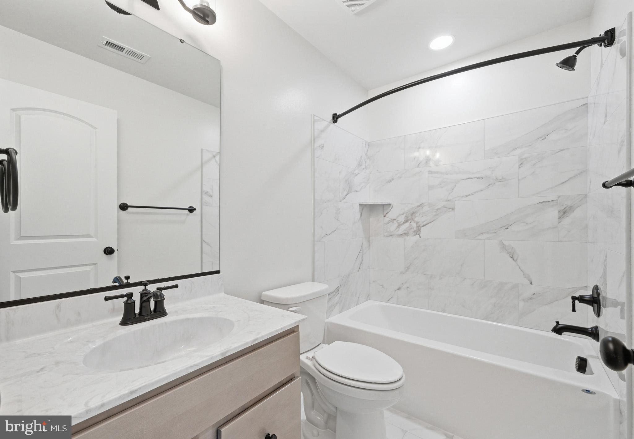 106 Potomac Court Prince Frederick, MD 20678 - Photo 40 of 47 a bathroom with a sink a toilet and a bathtub