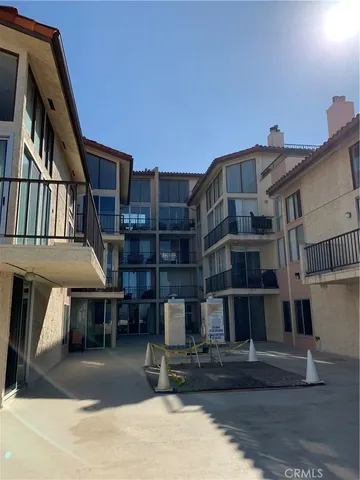 a view of a brick building with many windows