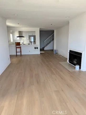a view of a livingroom with furniture and a flat screen tv