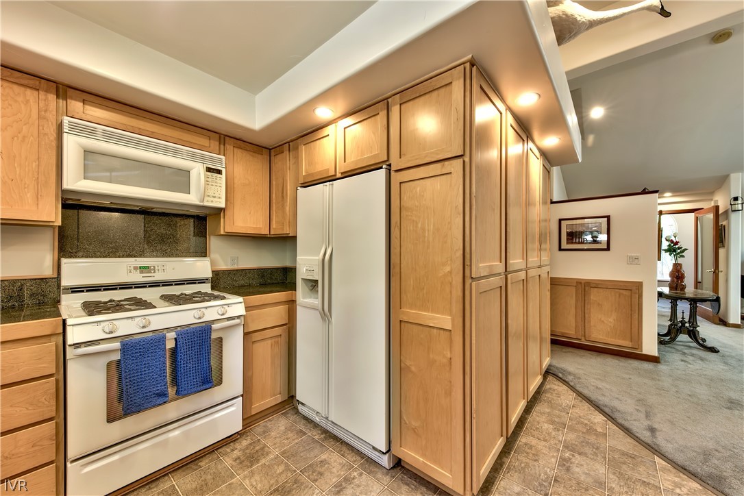 146 Tramway Road Incline Village, NV 89451 - Photo 18 of 34 a kitchen with a stove a refrigerator and a sink