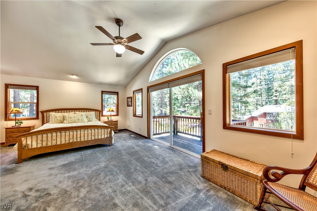 146 Tramway Road Incline Village, NV 89451 - Photo 25 of 34 a spacious bedroom with a bed and a large window