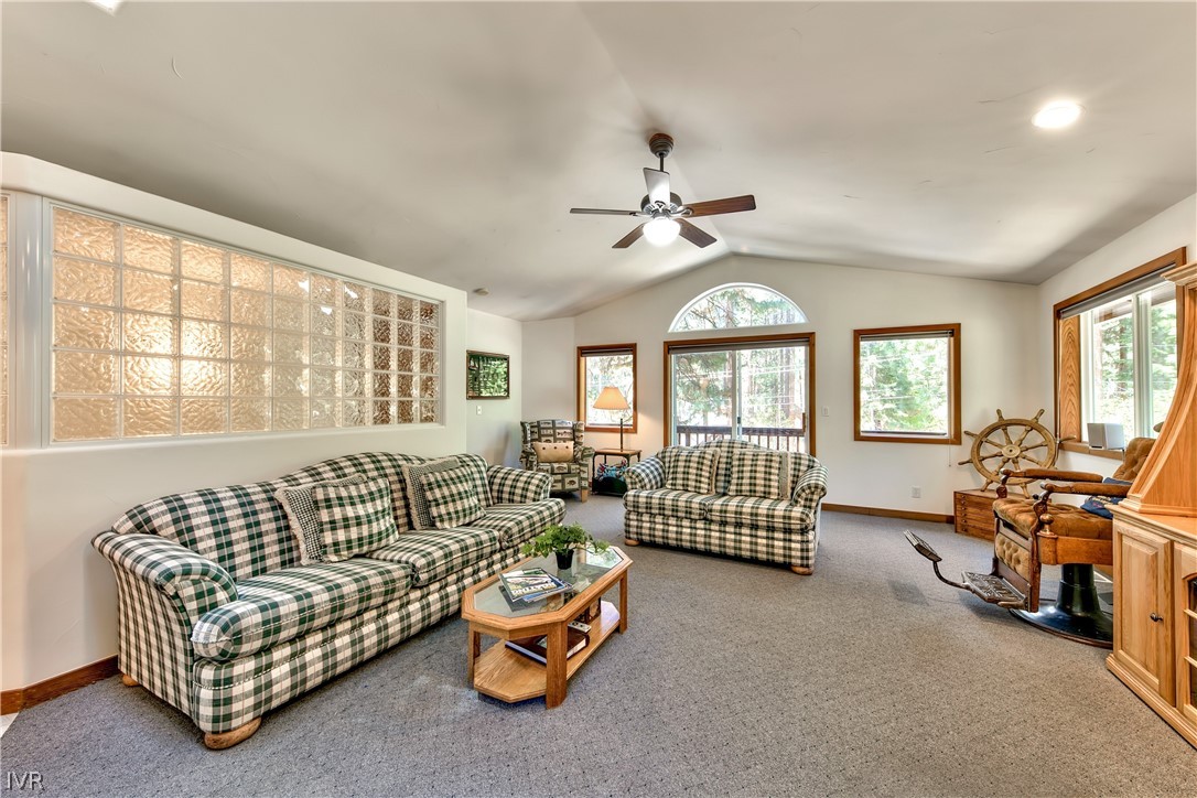 146 Tramway Road Incline Village, NV 89451 - Photo 32 of 34 a living room with furniture gym equipment and a large window