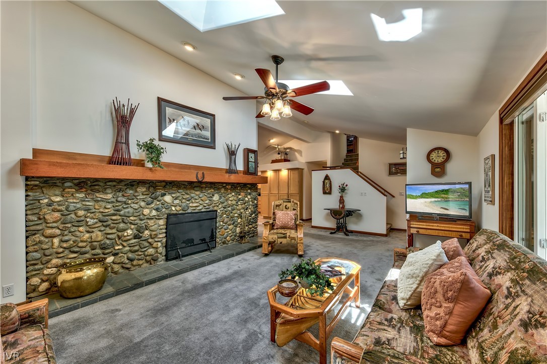 146 Tramway Road Incline Village, NV 89451 - Photo 10 of 34 a living room with furniture a flat screen tv and a fireplace