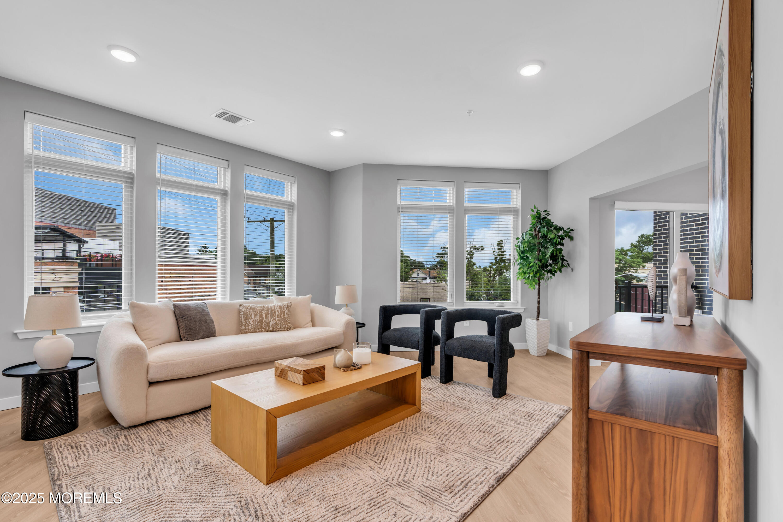 120 Monmouth Street, Unit NAVESINK111 Red Bank, NJ 07701 - Photo 11 of 38 a living room with furniture and a large window