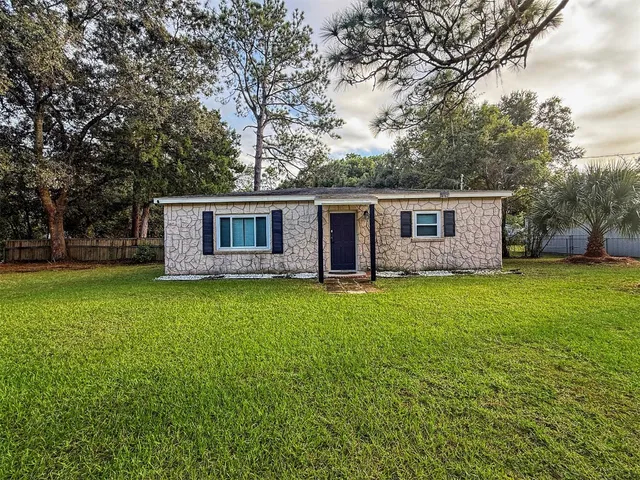 front view of a house with a yard