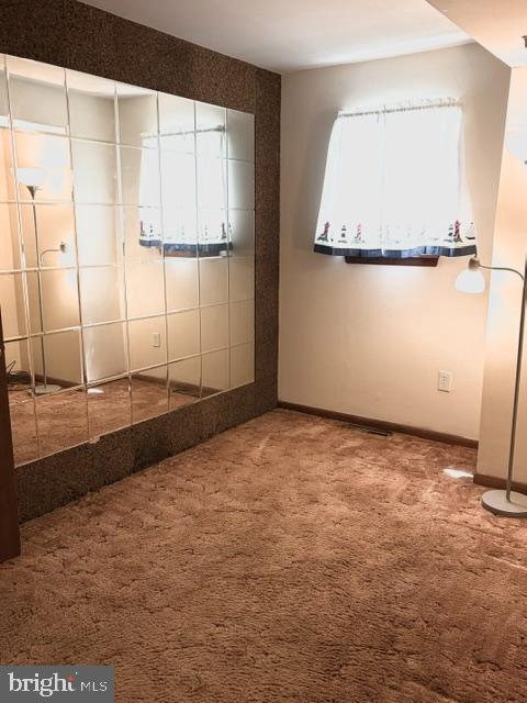 108 Kingbrook Road Linthicum Heights, MD 21090 - Photo 6 of 15 a view of a closet area with an empty room