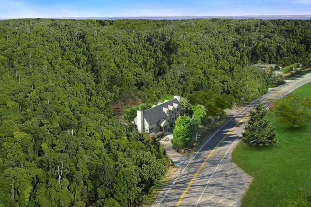 a view of a garden with a building in the background